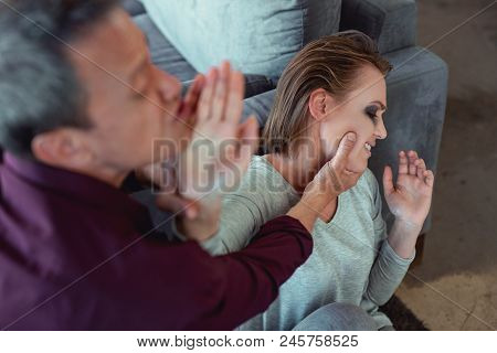 Family Abuse. Short-haired Young Woman Feeling Extremely Frightened Suffering From Family Abuse