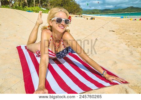 Smiling Vintage 50s Style Woman, Laying On American Flag Beach Towel In Hawaiian Tropical Lanikai Be