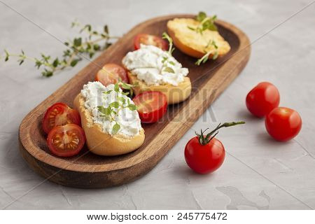 Italian Appetizer Toasted Bread Bruschetta With Cream Chease And Tomatoes. Delicious And Healthy Mea