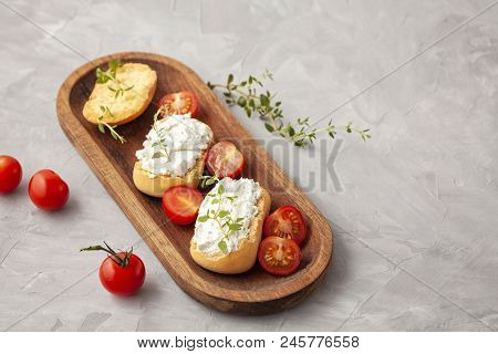 Italian Appetizer Toasted Bread Bruschetta With Cream Chease And Tomatoes. Delicious And Healthy Mea