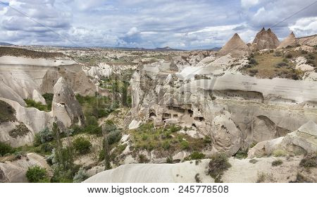 Abandoned Caves In The Cappadocia Mountains Against The Blue Sky