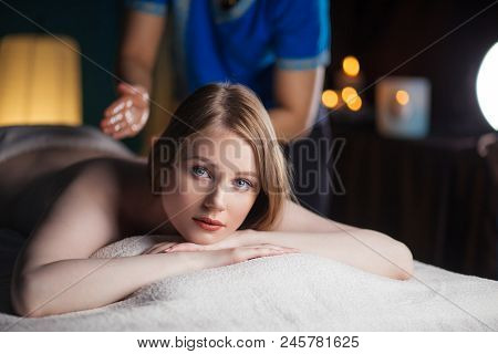 Massage And Body Care. Spa Body Massage Treatment. Woman Having Massage In The Spa Salon Looking At 