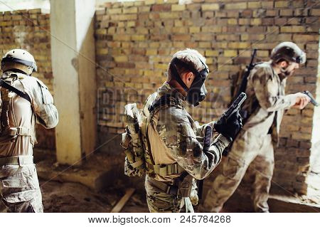 Three Soldiers Are In Room. They Are Preparing For A Fight. Guys Have Ammunition. One Of Them Has A 