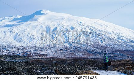 Tourist Walk In Iceland Volcanic Landscape Moutnian Background