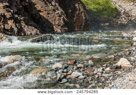 Water Rushes Past Rocks And Clifts On Denny Creek In Washington State.