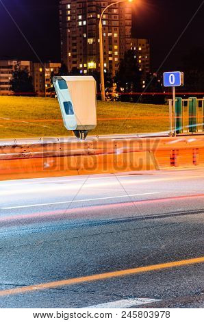 Stationary Car Speed Radar Near A Highway Road. Night Road Traffic Background