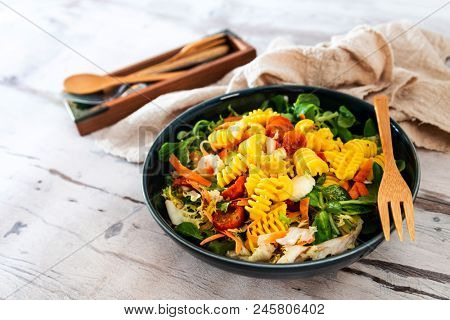 Salad made from radiatori cooked pasta, goat cheese and oil vinaigrette