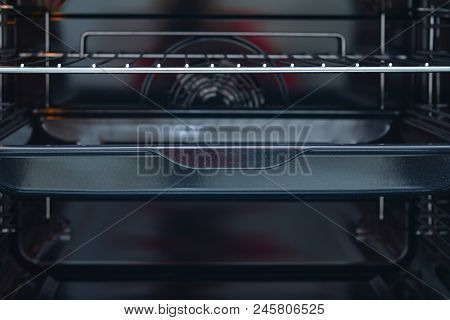 The Inside Of A Black Stove Oven