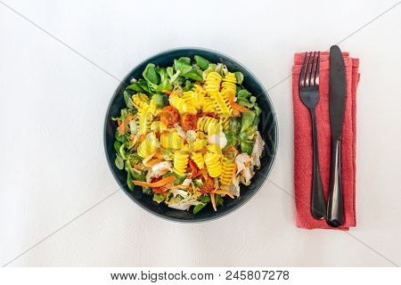 Salad made from radiatori cooked pasta, goat cheese and oil vinaigrette