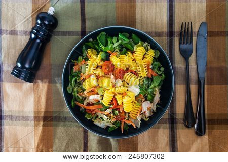 Salad made from radiatori cooked pasta, goat cheese and oil vinaigrette