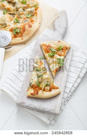 White Cheese Pizza With Artichoke And Arugula, White Background, Top View