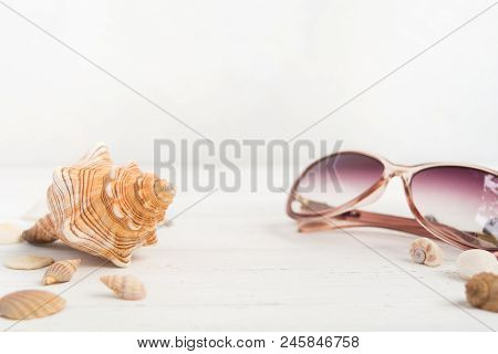 Big Shell And Sunglasses Like Summer Vactions Concept With Copy Space, Selective Focus