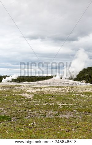 Steamy Old Faithful Geyser In Hydrothermal Systems Of Yellowstone National Park, Wyoming, Montana, I