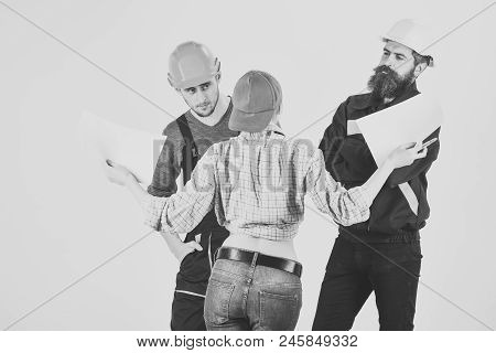 Technical Task Concept. Brigade Of Workers, Builders In Helmets, Repairers And Lady Discussing Contr