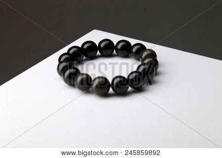  Black Obsidian stone bracelet , Chinese women's modern retro style fashion. Isolated on white background