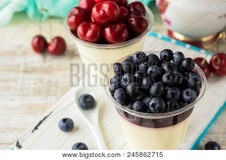 Italian Dessert Pana Cota With Berry Jam And Fresh Blueberries