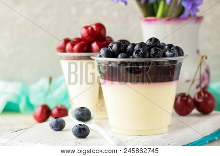 Italian Dessert Pana Cota With Berry Jam And Fresh Blueberries