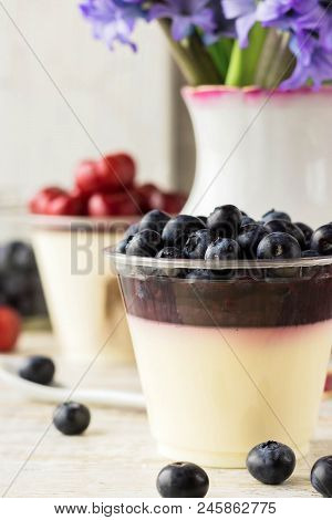 Italian Dessert Pana Cota With Berry Jam And Fresh Blueberries