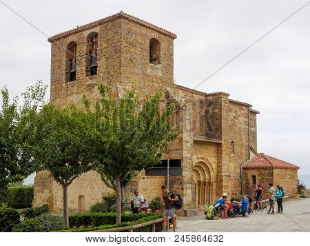 Pilgrims Have A Break On The Camino At The San Andres Church - Zariquiegui, Navarre, Spain, 5 Septem