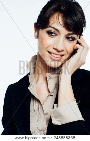 Young Caucasian Brunette Suit Dressed Business Woman Talking With A Vintage Smartphone. Standing Up.