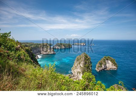 Aerial View Of The Small Island Of Nusa Batumategan And Nusa Batupadasan Island From The Atuh Rija L