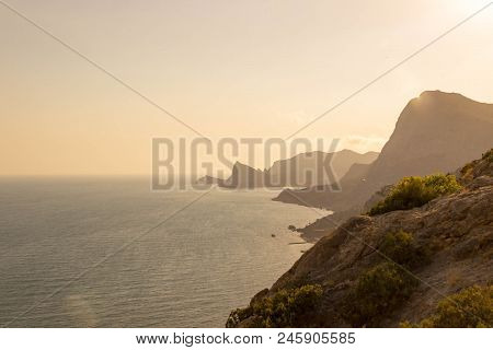 Beautiful Sunset Lights In A Rocky Coast Of Black Sea. Crimea Republic, Russia