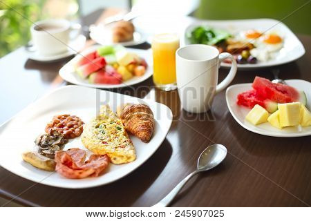 Morning Family Breakfast With Eggs, Coffee And Fruits. Close Up