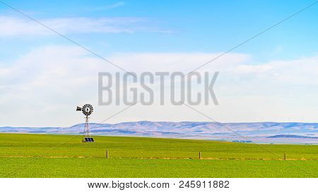 Old Windmill Connected To Sloar Batteries In Rural South Australia Near Snowtown