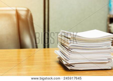Stack Of Student's Homework That Assigned To Students To Be Completed Outside The Class On Teacher's