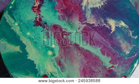 Painted Round Canvas In Green In Fluid Art Style