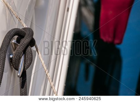 Dock Cleat On The Side Of A Boat In A Small Marina, An Element Of Yachting Equipment