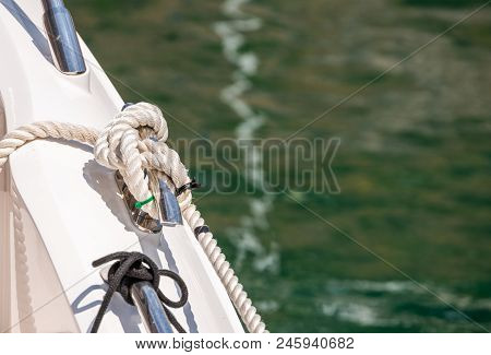 Dock Cleat On The Side Of A Boat In A Small Marina, An Element Of Yachting Equipment