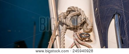 Dock Cleat On The Side Of A Boat In A Small Marina, An Element Of Yachting Equipment