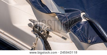 Dock Cleat On The Side Of A Boat In A Small Marina, An Element Of Yachting Equipment