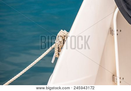 Dock Cleat On The Side Of A Boat In A Small Marina, An Element Of Yachting Equipment