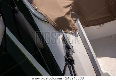 Dock Cleat On The Side Of A Boat In A Small Marina, An Element Of Yachting Equipment