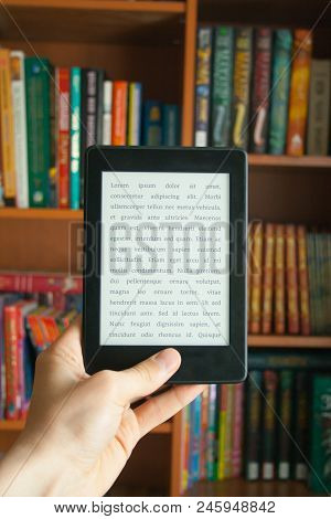 E-book In Man's Hand With Lorem Ipsum Text