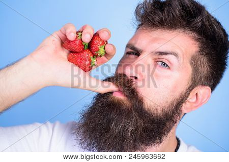 Fresh Juice Concept. Man Strict Face Enjoy Fresh Drink Strawberry Juice. Man Drinks Strawberry Juice