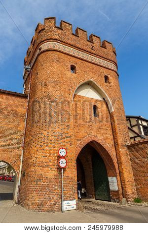 Torun, Poland - 05 April 2014: Bridge Tower Gate And City Walls. The Tower Is Located Neighborhood O