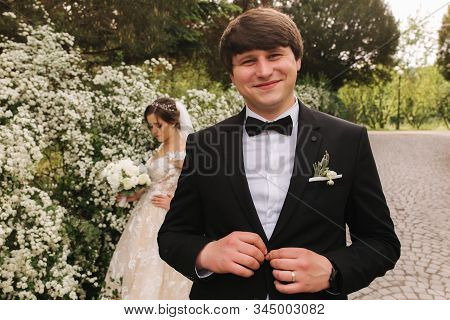 Handsome Groom Staind In Front Of Beutiful Bride
