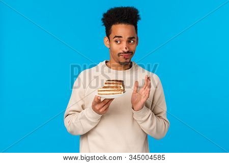 Guy Tried Biting Cake Didnt Like Taste. Displeased And Unimpressed Skeptical, Picky African-american