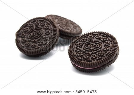 Oreo Biscuits Isolated On White Background. Sandwich Chocolate Cookies With Strawberry And A Sweet C