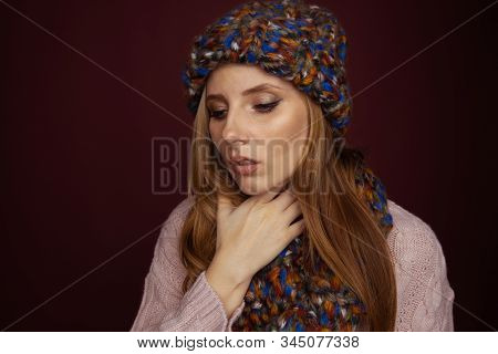Sore Throat Concept. Sick Woman In Hat And Scarf Holding Her Nech And Felling Bad.