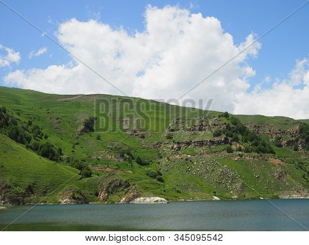 Beautiful Landscape Overlooking The Blue Lake In The Mountains. Lake Giggit In The Region Of Elbrus.