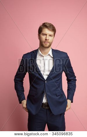 Portrait Of Young Confident Caucasian Man Isolated On Coral Background. Valentines Day Celebration. 