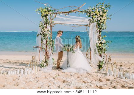 September 3, 2019. Bali, Indonesia. Wedding Ceremony At Tropical Beach. Wedding Arch And Caucasian C