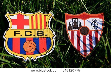 September 6, 2019, Madrid, Spain. Emblems Of Spanish Football Clubs Barcelona And Sevilla On The Gre