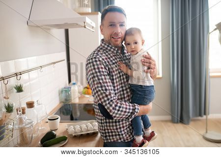 Sweet Little Girl In A White Shirt Looking Happy