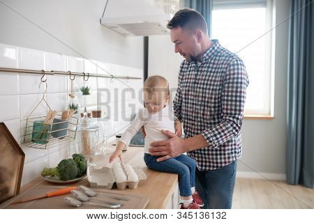 Sweet Little Girl In A White Shirt Feeling Good With Her Father