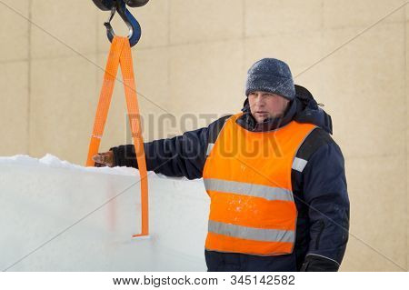 Portrait Of Installer At Unloading Ice Blocks